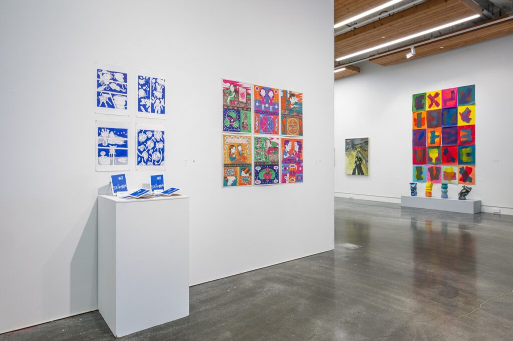 Multiple collections of print media works are displayed on the gallery wall, with booklets of prints displayed on a plinth. Featuring bright colours and graphic illustrative style, the room feels alive and cinematic.